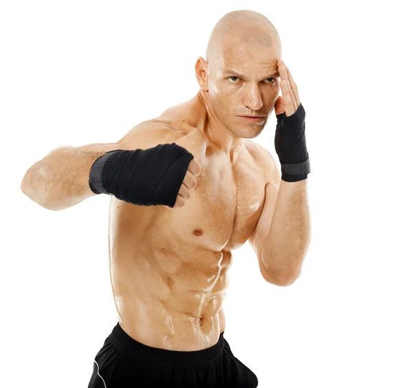 Very fit kickboxer punching — Stock Photo, Image