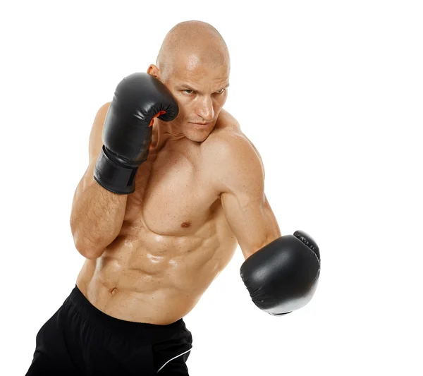 Very fit kickboxer punching — Stock Photo, Image