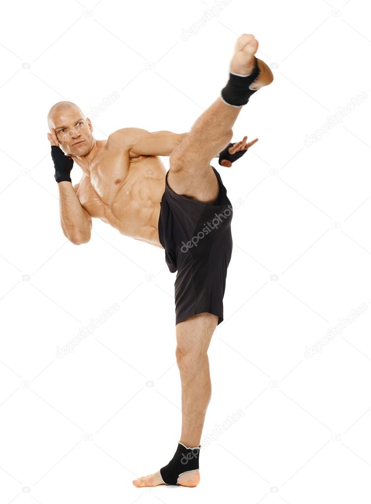 Kickboxer executing a powerful kick