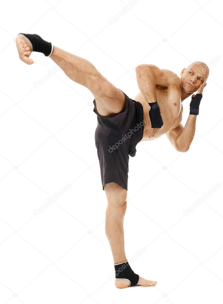 Kickboxer executing a powerful kick