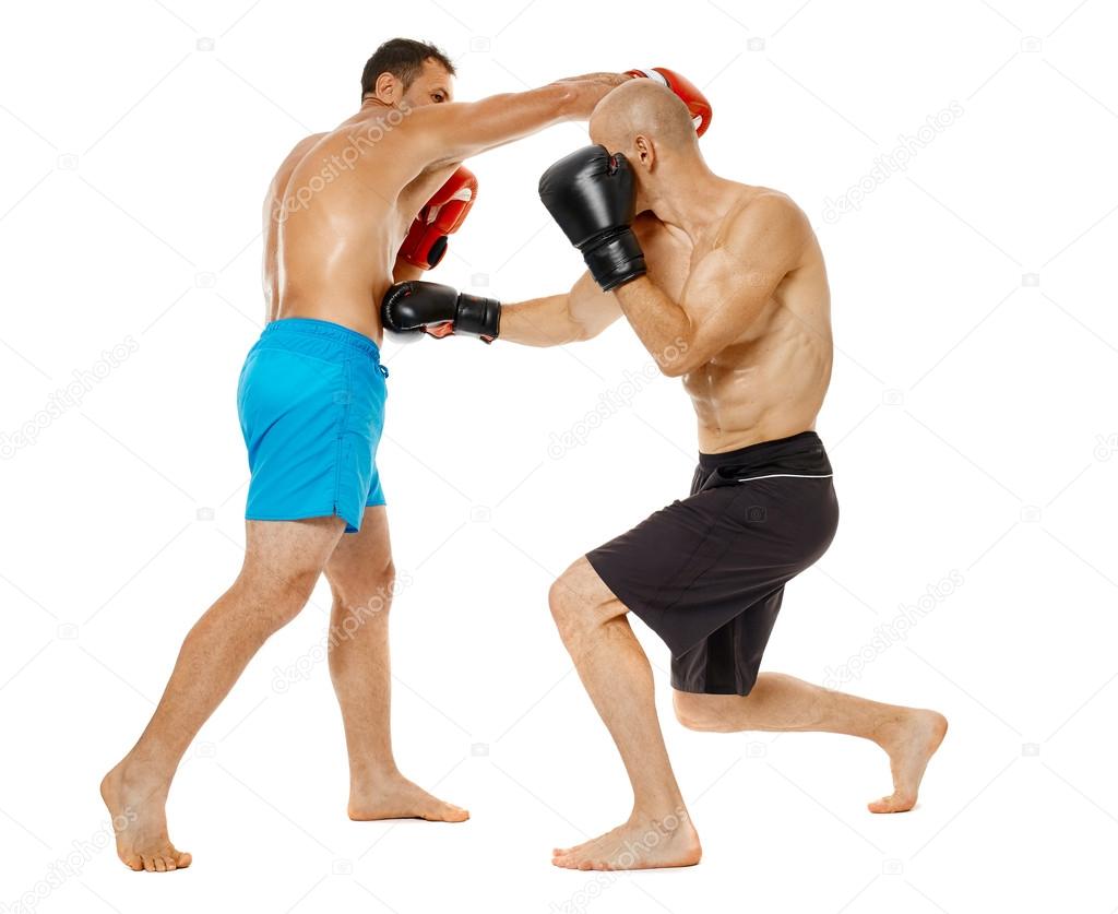 Kickboxers sparring on white