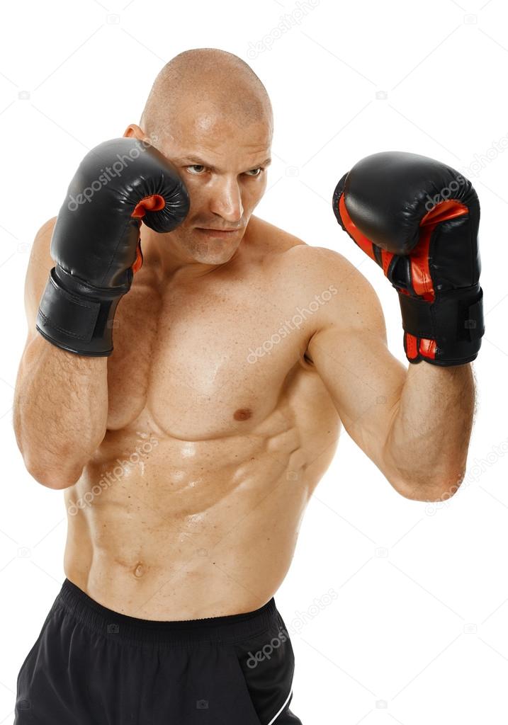 Very fit kickboxer punching