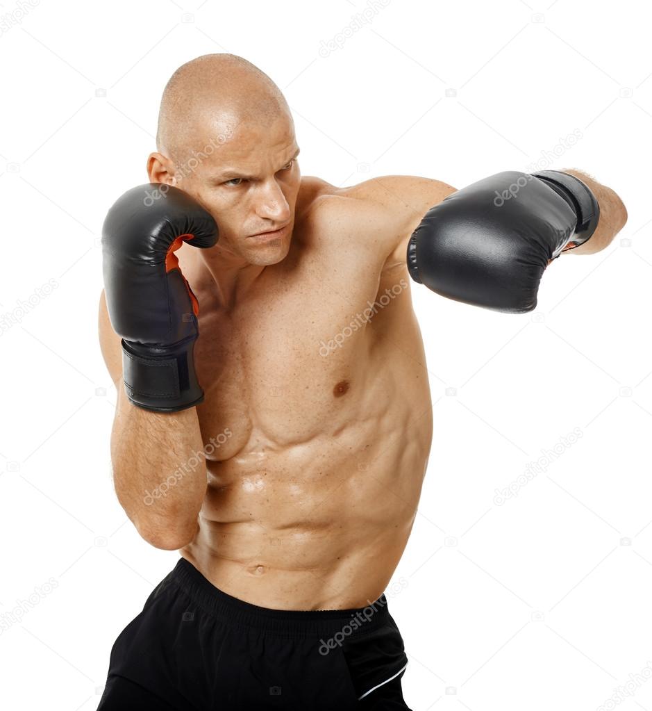 Very fit kickboxer punching