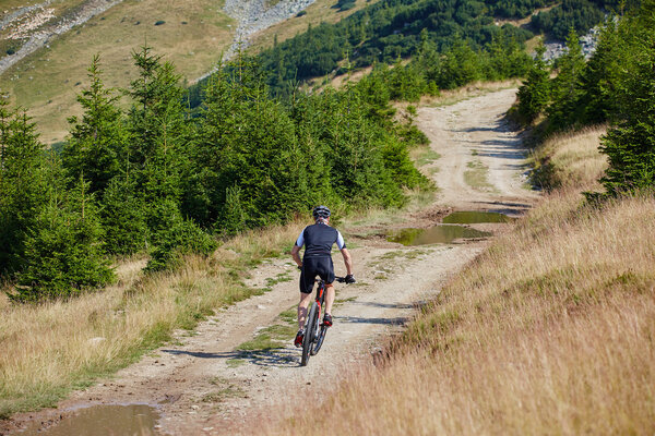 cyclist  riding on rugged trails