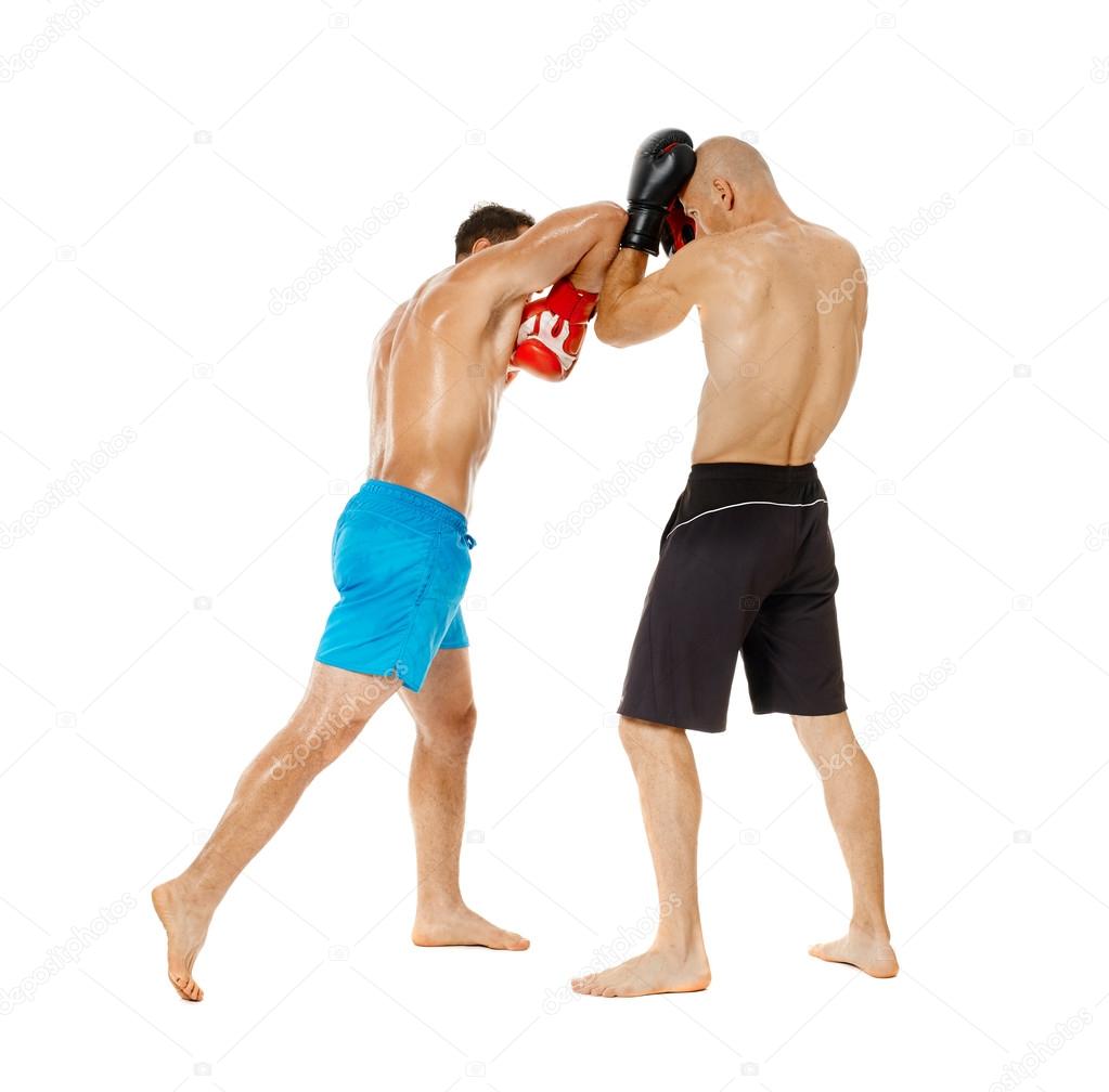 Two kickbox fighters sparring