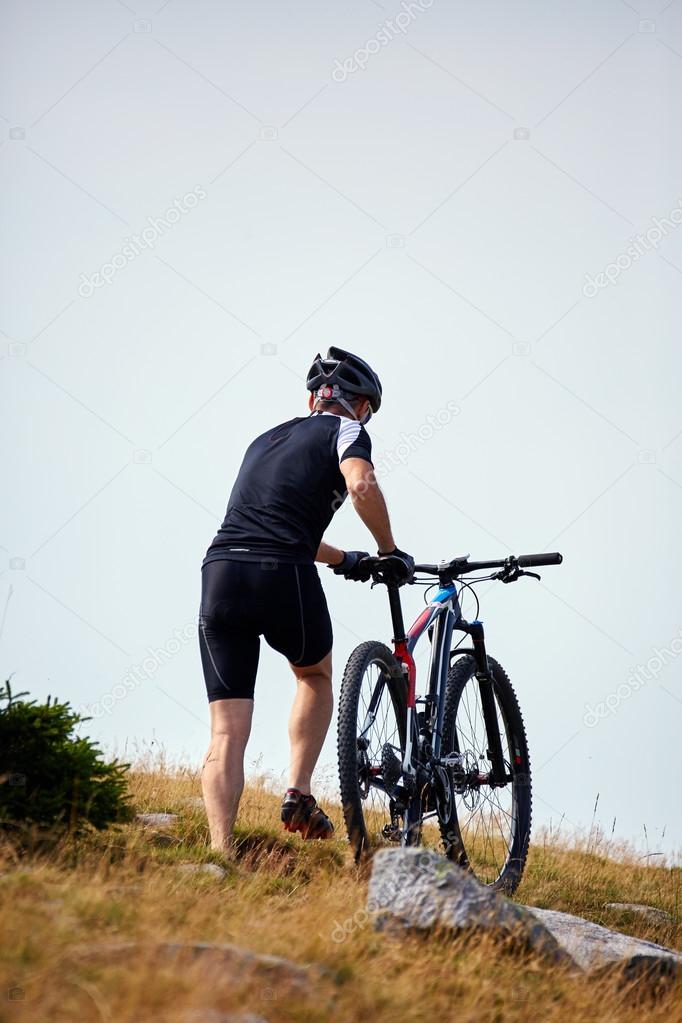cyclist  riding on rugged trails