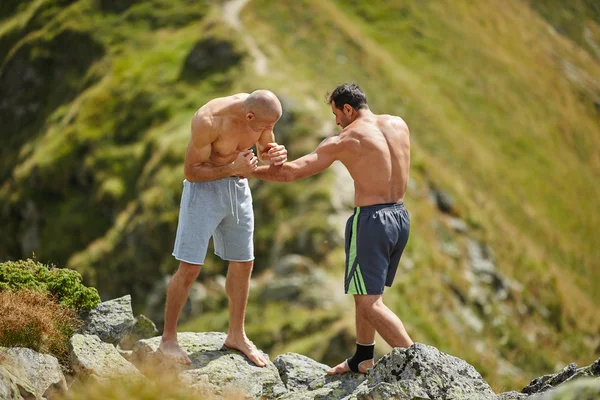 Fighters sparring in the mountains — Stock Photo, Image