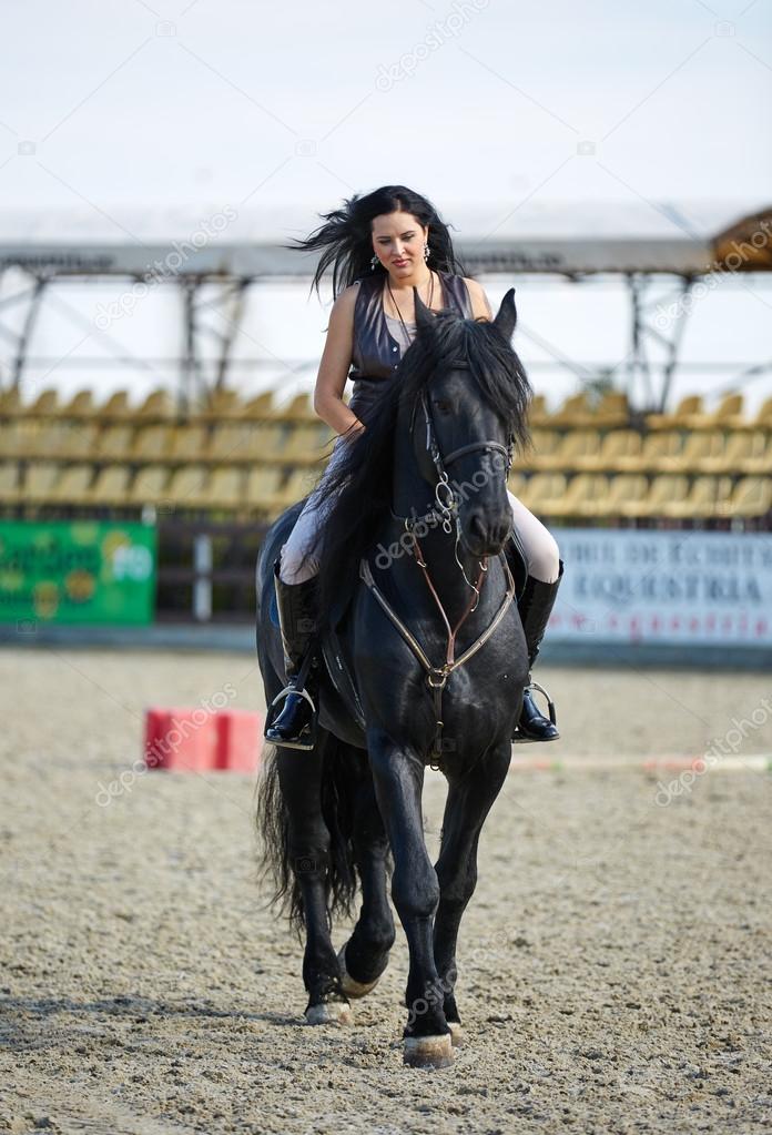 young woman riding a horse