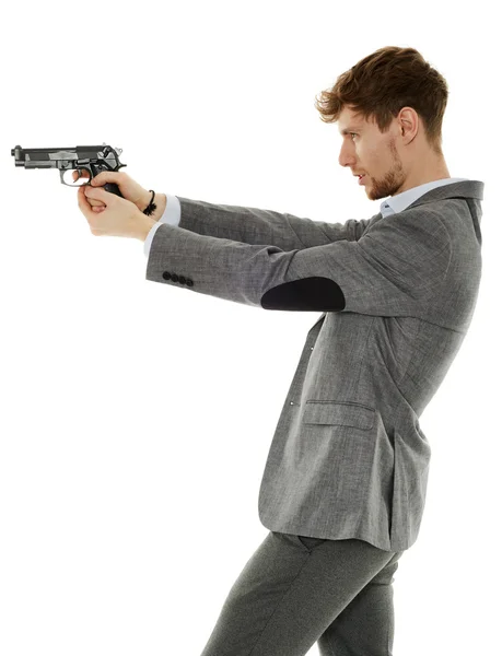 Young man using handgun — Stock Photo, Image