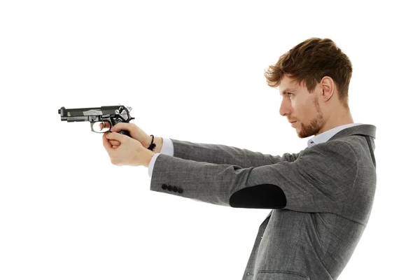 Young man using handgun — Stock Photo, Image