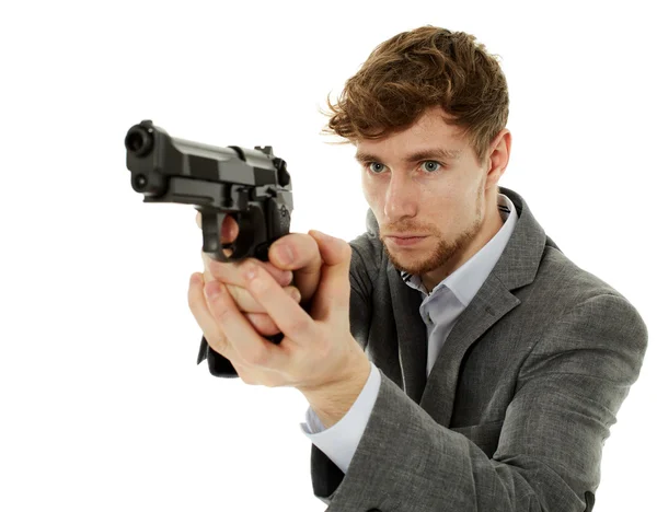 Closeup of a young man with a gun — Stock Photo, Image