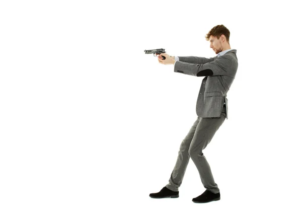 Handsome man using a gun — Stock Photo, Image