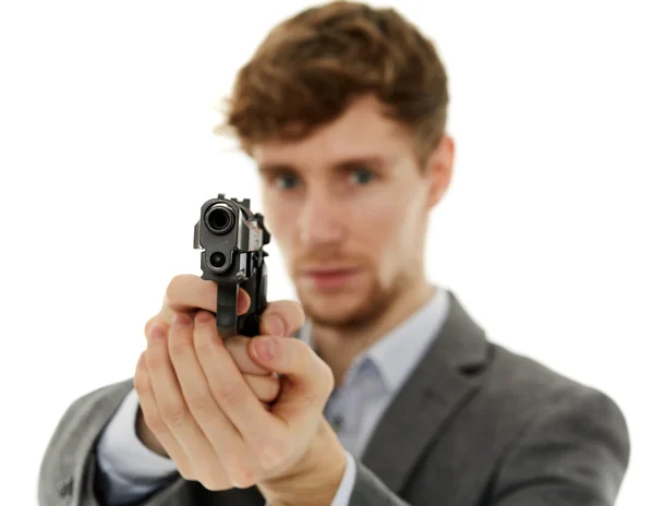 Closeup of a young man with a gun — Stock Photo, Image