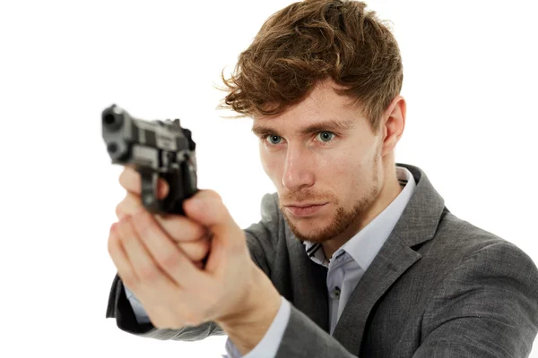 Nahaufnahme eines jungen Mannes mit einer Waffe — Stockfoto