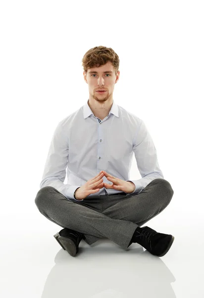 Homem de negócios meditando no branco — Fotografia de Stock