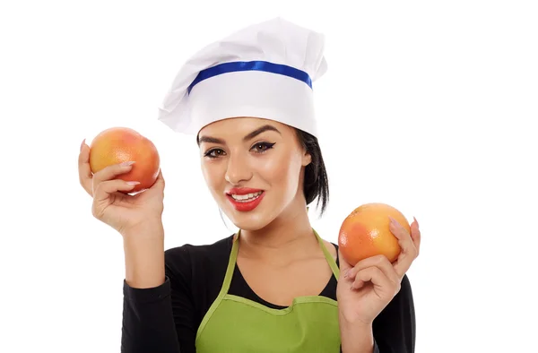 Vrouw met grapefruits — Stockfoto