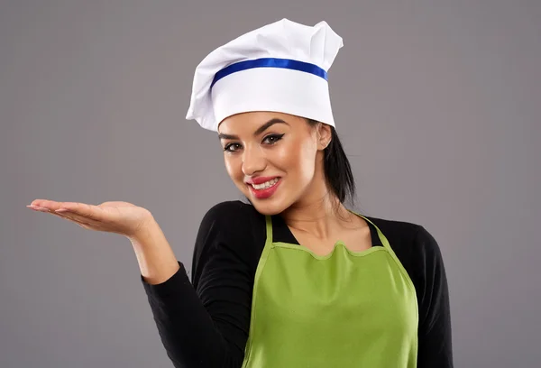 Woman cook showing copyspace — Stock Photo, Image