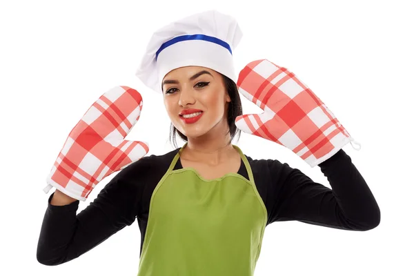 Woman wearing oven gloves — Stock Photo, Image