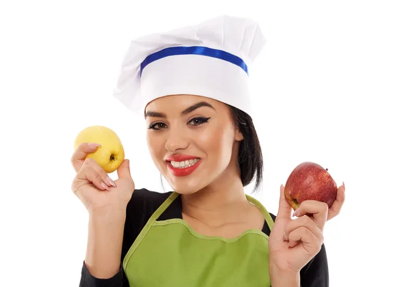 Woman chef holding apples Royalty Free Stock Images