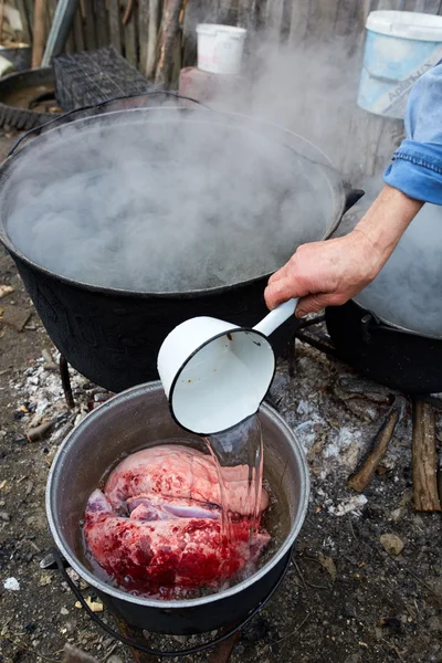 Woman pouring boiled water — Stock Photo, Image