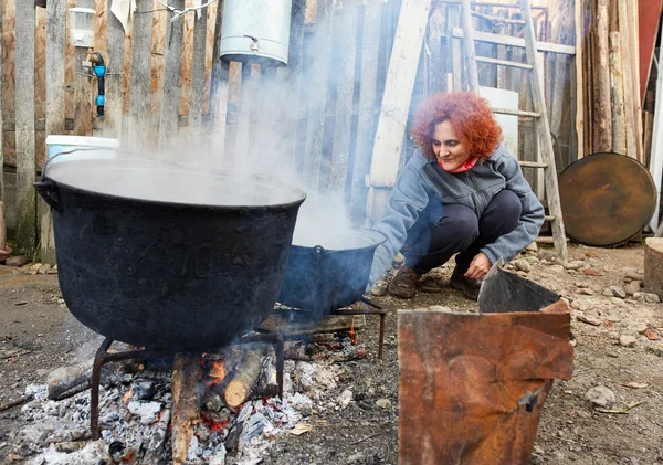 Woman boiling water — Stock Photo, Image