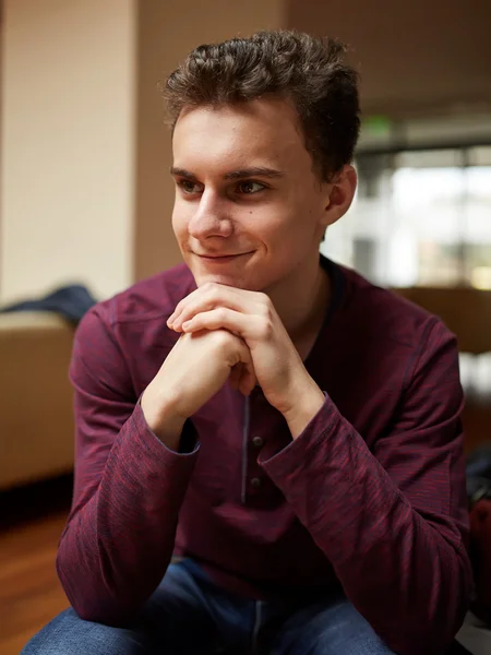 Teenage boy in a restaurant posing — Stock Photo, Image