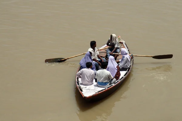 People swimming in river on boat