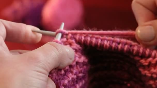 Winter time. Woman hands close up knitting with wool. — Stock Video