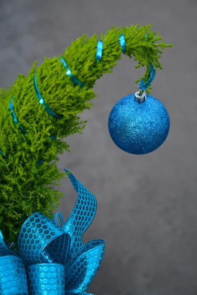 Little christmas tree with blue ornament — Stock Photo, Image