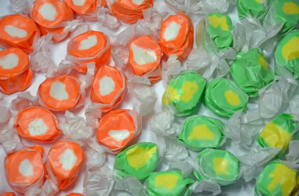 Green and orange taffy candy — Stock Photo, Image