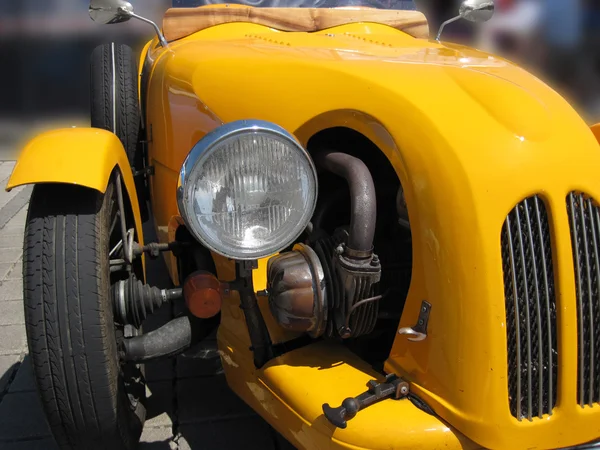 Front of a yellow old timer — Stock Photo, Image