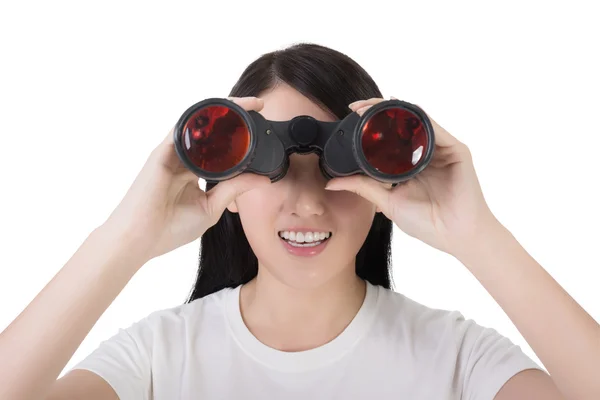 Woman using binoculars — Stock Photo, Image