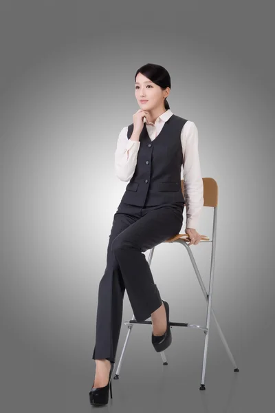 Business woman sit on a chair — Stock Photo, Image