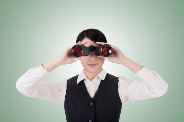 Business woman holding a binoculars — Stock Photo, Image
