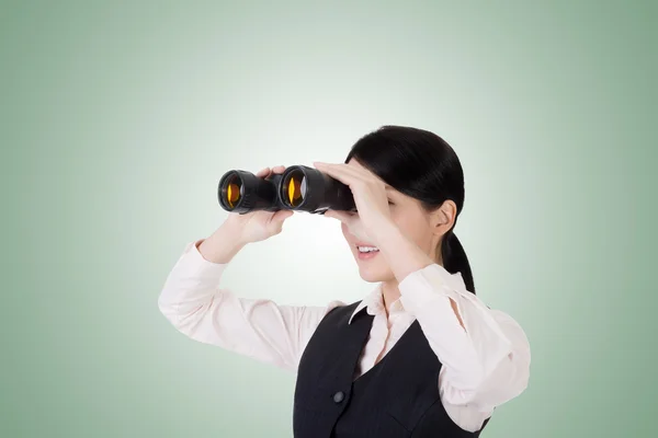 Business woman holding a binoculars — Stock Photo, Image