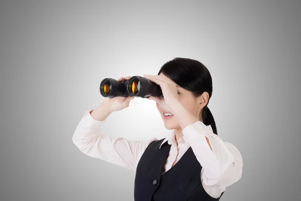 Business woman holding a binoculars — Stock Photo, Image