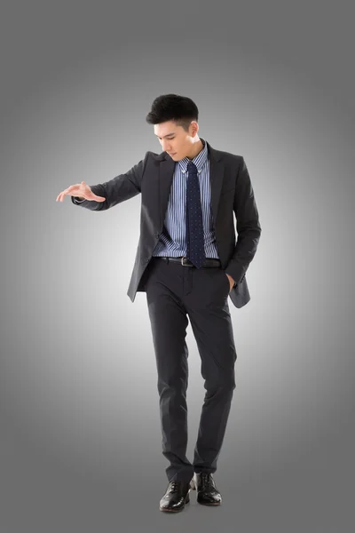 Holding pose of Asian business man — Stock Photo, Image