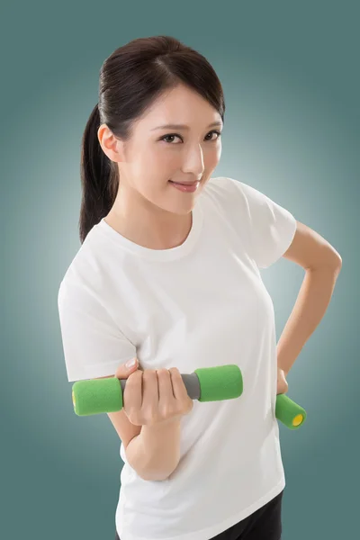 Woman holding dumbbell — Stock Photo, Image