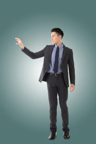 Holding pose of Asian business man — Stock Photo, Image