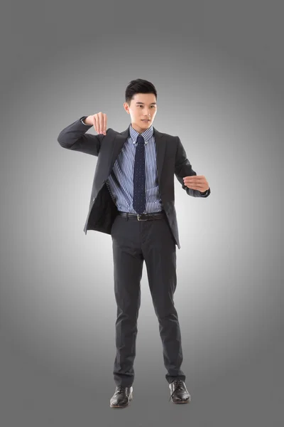 Halten Pose von asiatischen Geschäftsmann — Stockfoto