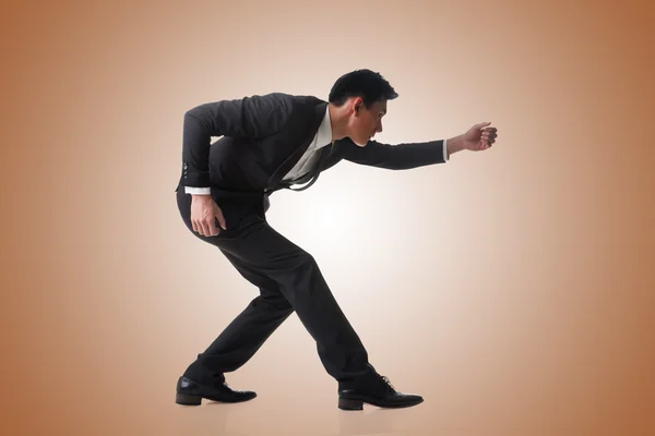 Business man posing tug of war — Stock Photo, Image