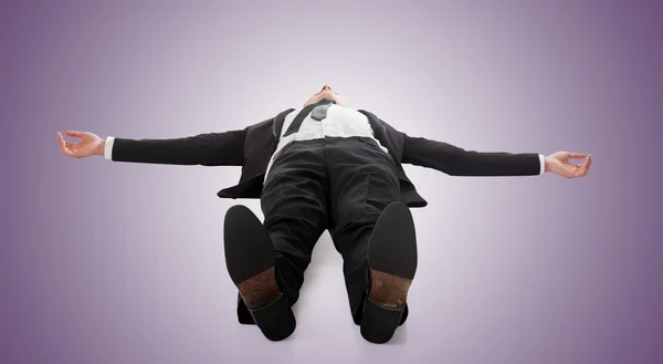 Businessman lying on ground — Stock Photo, Image