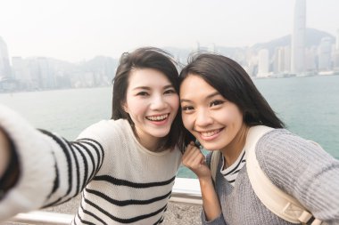 Asian young girls take a selfie clipart