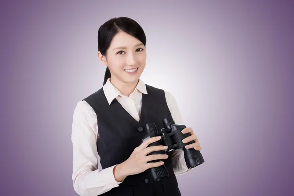 Business woman holding a binoculars — Stock Photo, Image