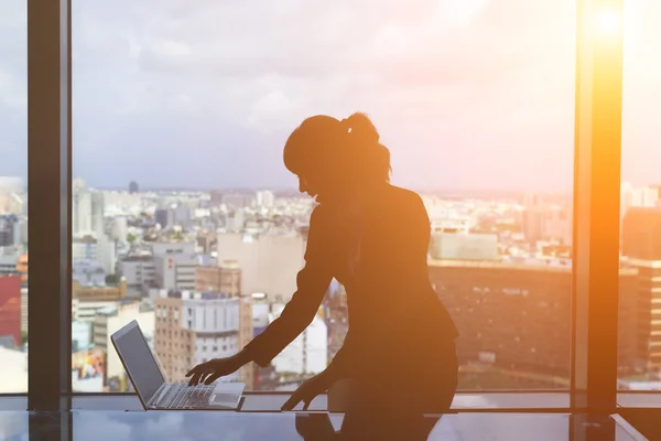 Silhouette of businesswoman work — Stock Photo, Image