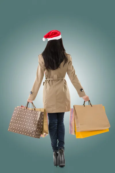 Christmas girl holding shopping bags — Stock Photo, Image