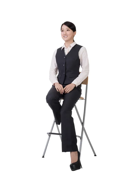 Business woman sit on a chair — Stock Photo, Image