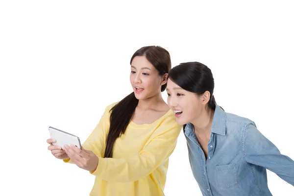 Girl use pad with her friend — Stock Photo, Image