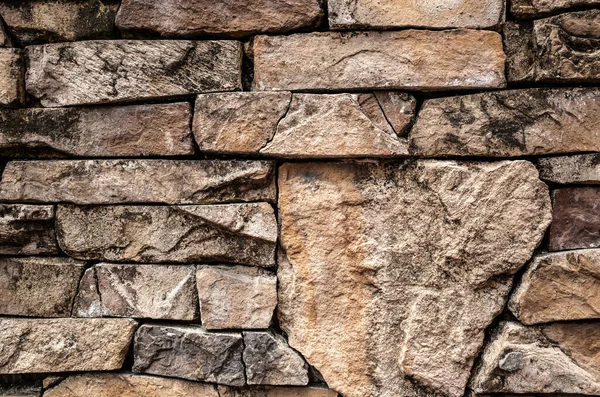 stone stacked wall in brown aged color background