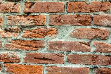 Kirli kırmızı tuğlaların arkaplanı iyi desenli duvarlar